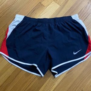 Red white and blue Nike running shorts